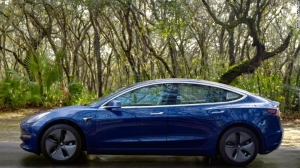 Tesla cuts jobs to offset Model 3 cost