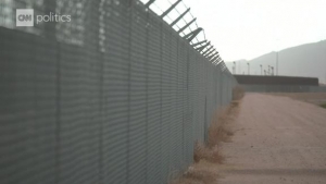 Ahead of Trump’s El Paso visit, dozens of Americans link hands at the southern border forming a human wall