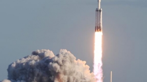 SpaceX’s Falcon Heavy rocket launches first paid mission and lands all three boosters