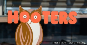 One of two men suing Hooters over alleged sexual harassment has settled his case.