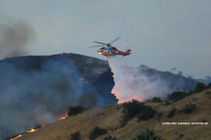 A new California wildfire breaks out in LA as a million people face days without power